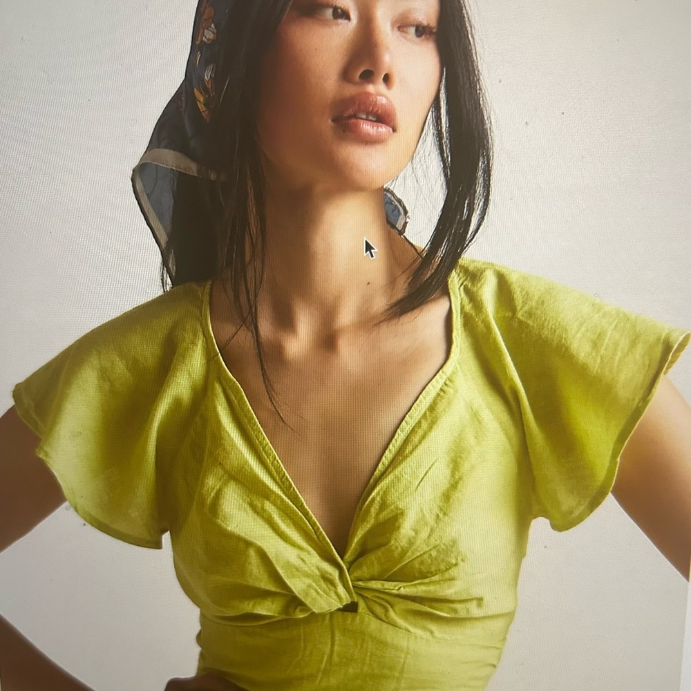 Green twist front blouse.